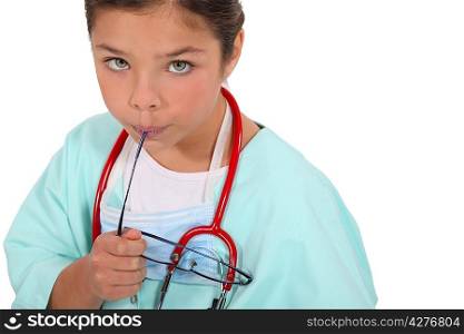 Child dressed as a doctor in scrubs