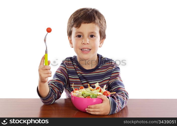 Child eating salad a over white background