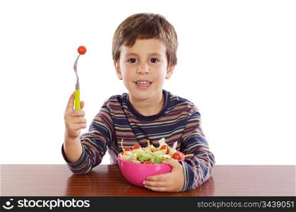 Child eating salad a over white background