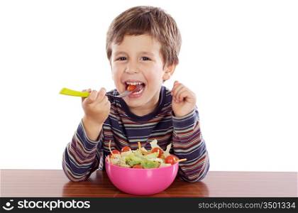 Child eating salad a over white background