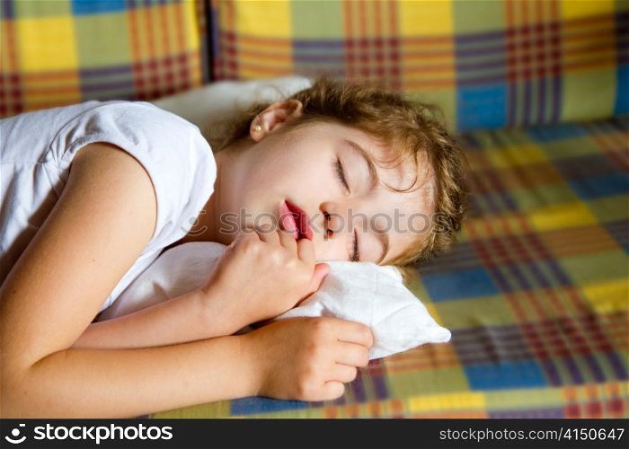 child girl sleeping bed in retro vintage quilt with pillow
