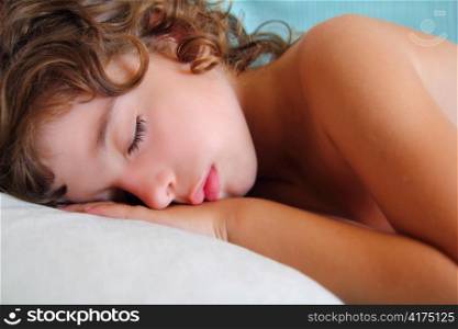 child girl sleeping happy on pillow in summer time