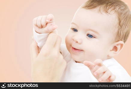 child, happiness and people concept - adorable baby boy