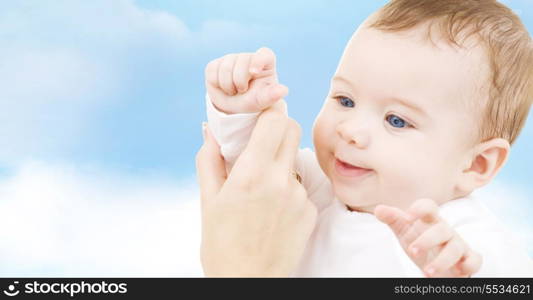 child, happiness and people concept - adorable baby boy