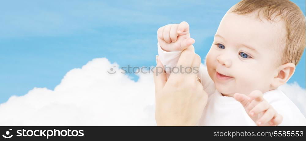 child, happiness and people concept - adorable baby boy