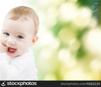 child, happiness and people concept - adorable baby boy