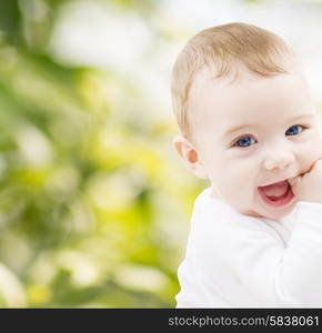 child, happiness and people concept - adorable baby boy