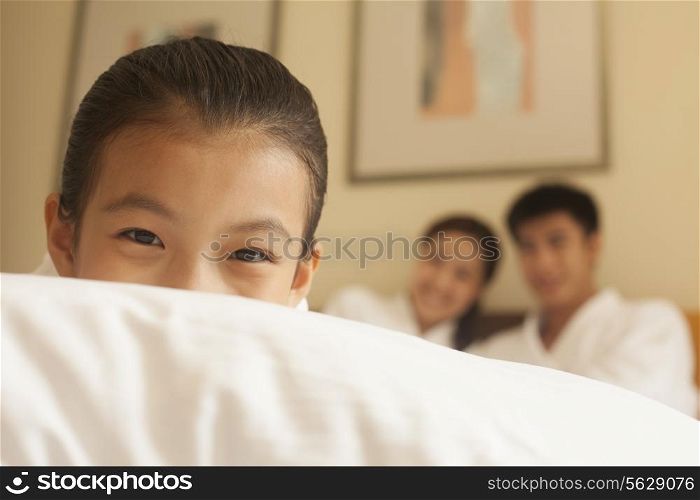 Child Hiding Behind Pillow