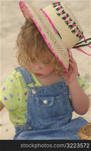 Child holding hat