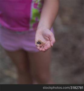 Child holding leaf