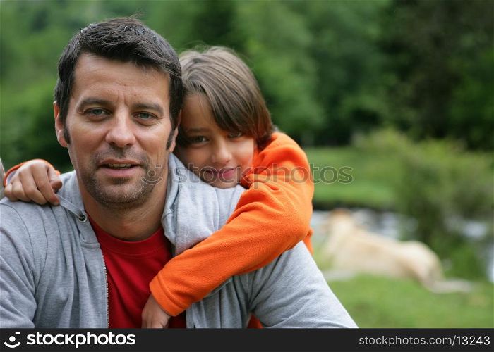 Child hugging father