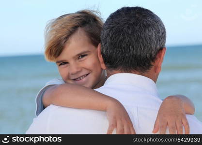 Child hugging his father