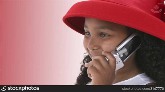 Child In Red Hat Talking On Cellphone.