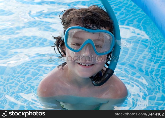 Child in the pool on holiday learning to swim