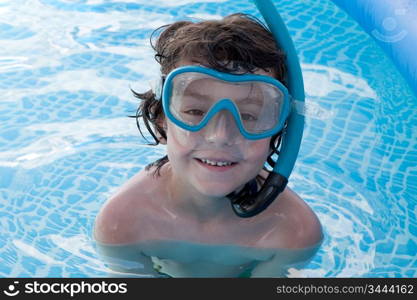 Child in the pool on holiday learning to swim