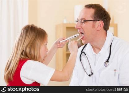 Child is examining throat of her doctor; he tries to make her comfortable before the examination