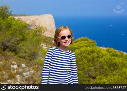 child kid girl in mediterranean sea with summer sailor blue stripes