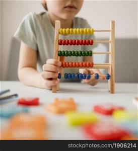 child learning use abacus home. High resolution photo. child learning use abacus home. High quality photo