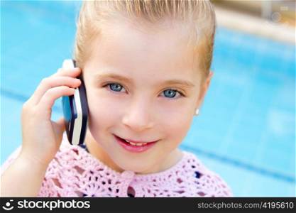 child little girl talking mobile phone in pool with happy gesture