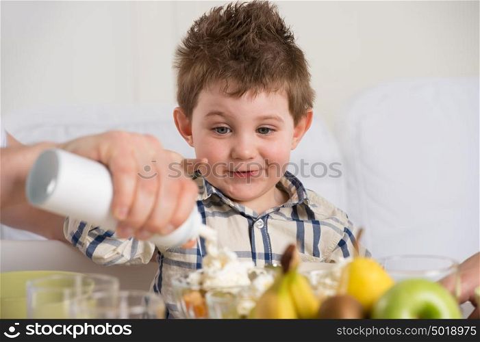 Child on breakfast - having fun