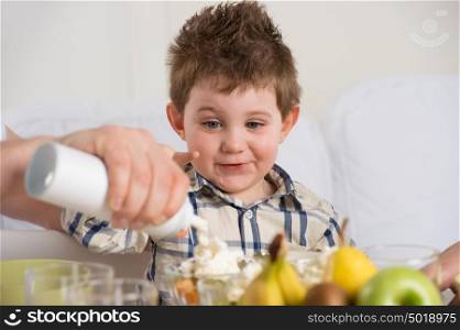 Child on breakfast - having fun