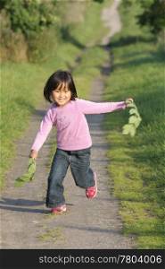 child outdoor in a forest path