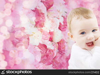 child, people and happiness concept - adorable baby boy