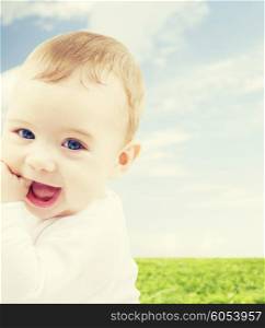 child, people and happiness concept - adorable baby boy