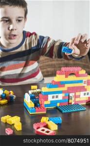 Child play with children's plastic constructor toys