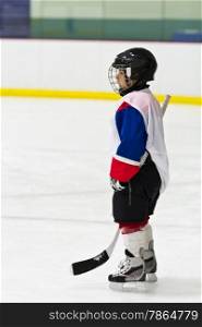 Child playing ice hockey