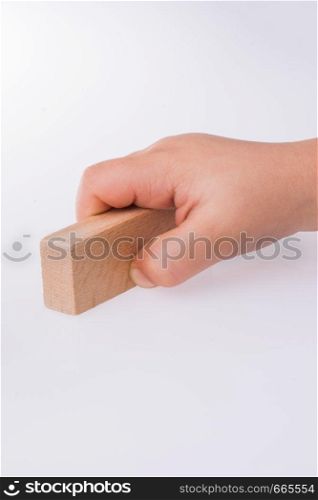 Child playing with building blocks on white background
