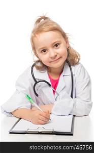 Child preschooler in doctor costume, playing in the medical profession