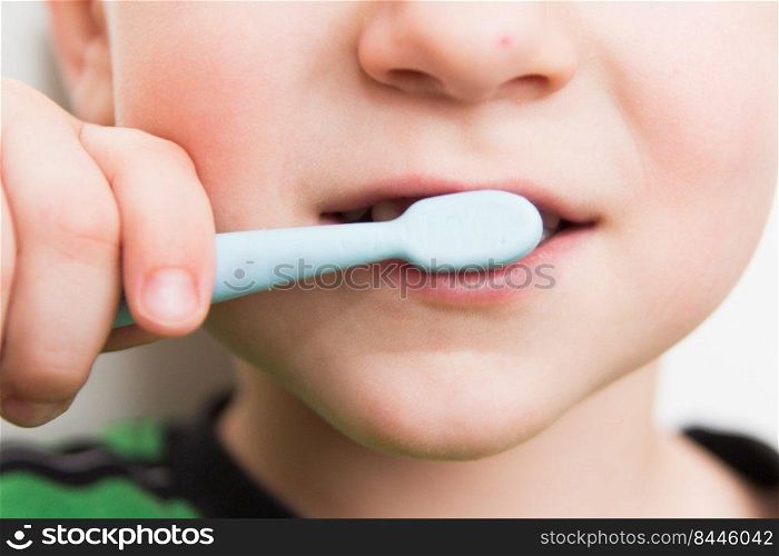 child’s teeth with a toothbrush