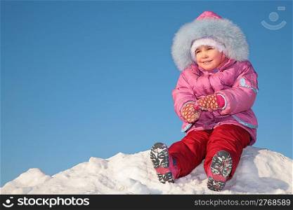 child sit on snow hill 2