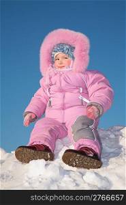 child sit on snow hill