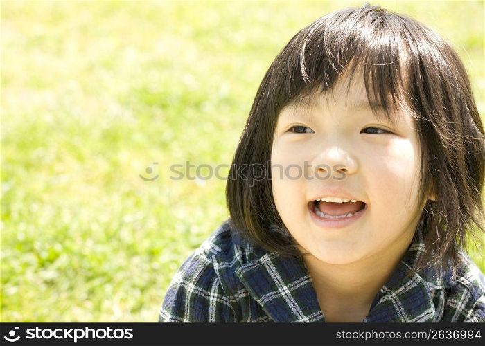 child smiling in park