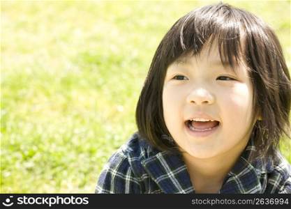 child smiling in park