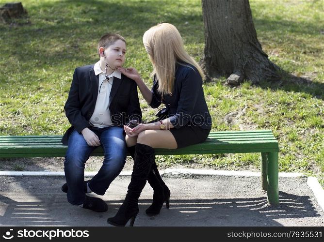 child talks to the mother in the park