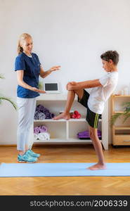 Child training with physical therapist for balance improvement