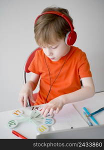child wearing headphones e learning concept