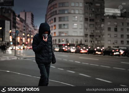 Child with Air Pollution Mask, Traffic in the Background . Child with Air Pollution Mask, Traffic in the Background