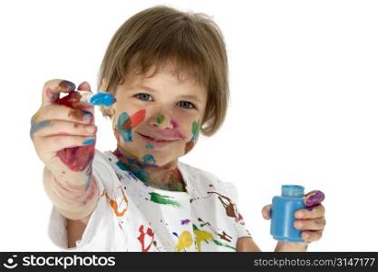 Child with blue paint bottle and brush. Covered in paint. Clipping path.