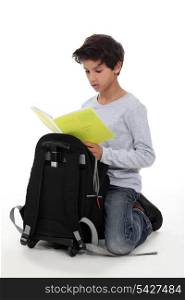 child with briefcase and notebook