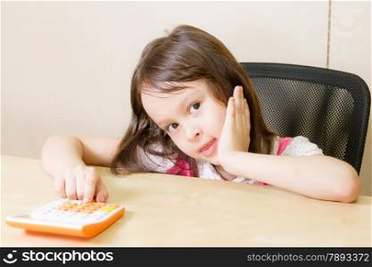 Child with calculator in corporate office