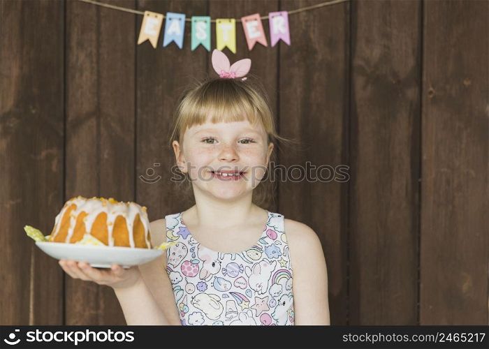 child with holiday cake plate