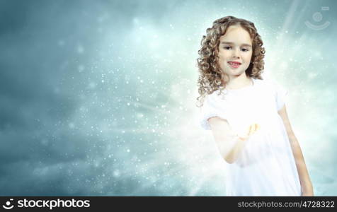 Child with magic light. Little girl with magic lights and shining around