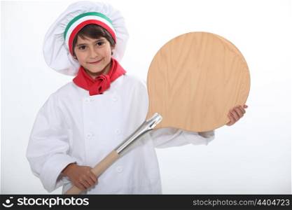 Child with oven shovel