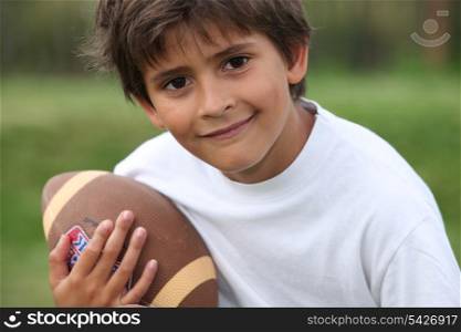 Child with rugby ball
