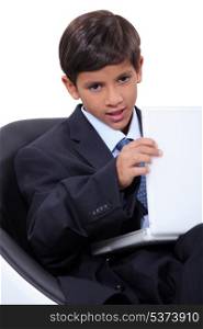 Child with suit and computer