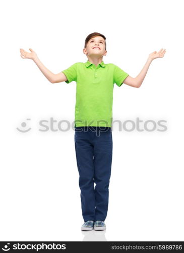 childhood, achievement, gladness and people concept - happy smiling boy in green polo t-shirt raising hands and looking up